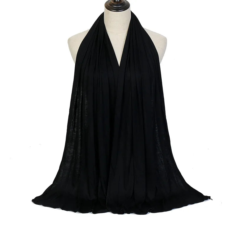 Long Muslim shawl made of modal cotton jersey fabric, wrapped elegantly around the head and ne