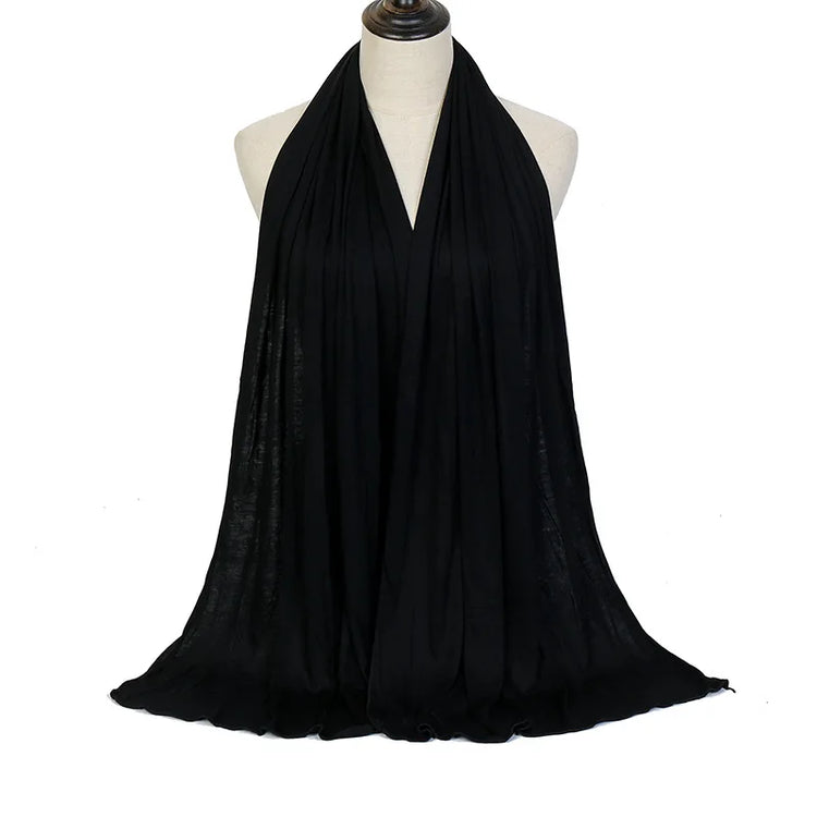 Long Muslim shawl made of modal cotton jersey fabric, wrapped elegantly around the head and ne