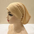 Lightweight spandex turban bonnet in beige, styled under a chiffon hijab