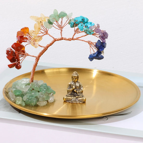 Decorative chakra crystal tree with Buddha figurine for enhancing positive energy in living areas