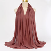 Lightweight voile headscarf in soft pastel tones, ideal for Muslim women&
