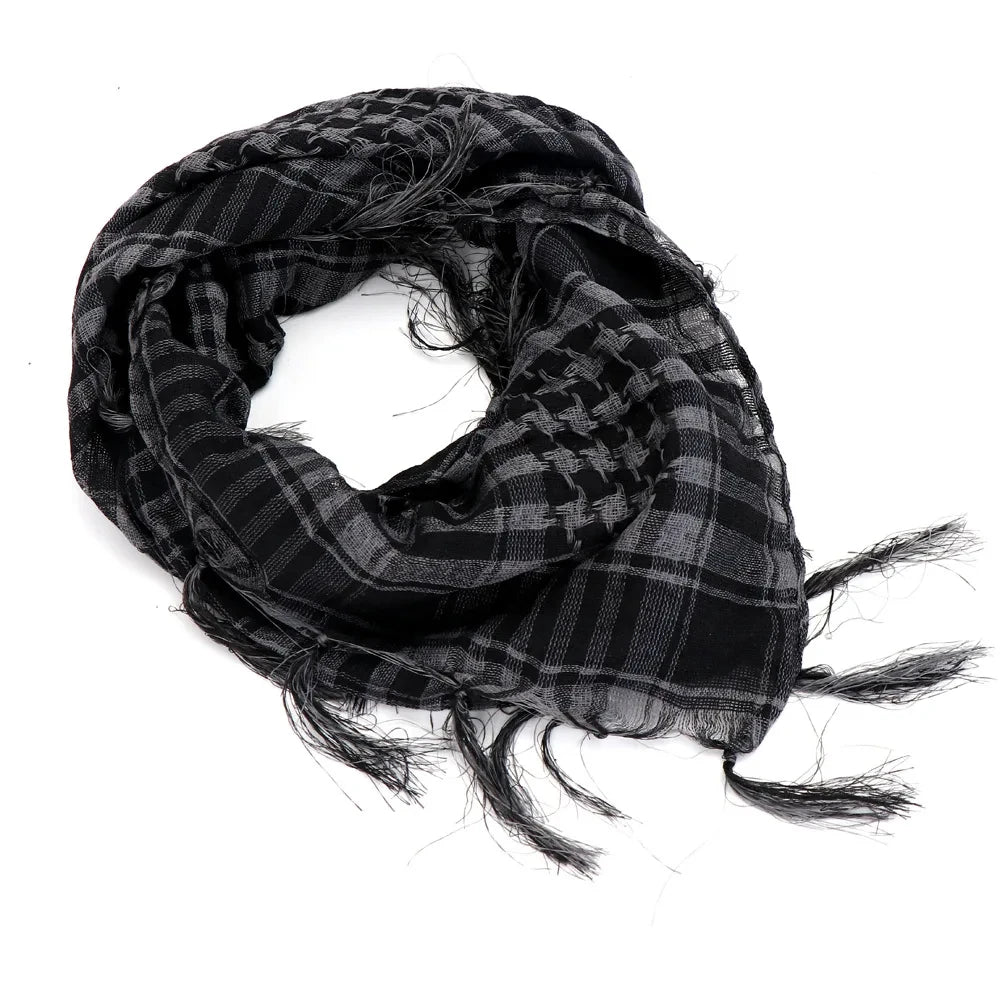 Arab shemagh scarf with traditional houndstooth pattern, styled as a face and neck wrap for sun protection