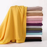 Soft plain cotton headscarf for women, used as a hijab or stylish headband wrap