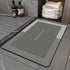 Water-absorbing bath mat with anti-skid backing