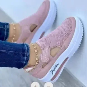 Women’s walking shoes with elevated platform sole and breathable mesh material