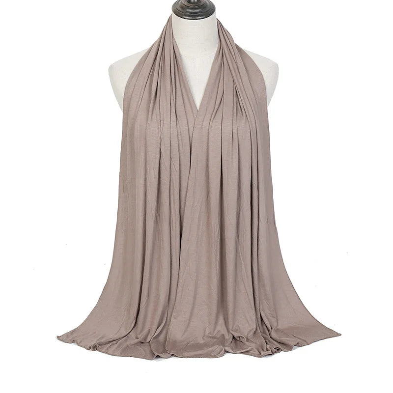Long Muslim shawl made of modal cotton jersey fabric, wrapped elegantly around the head and ne
