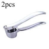 Stainless steel manual garlic press for crushing garlic into paste