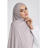 Long Muslim shawl made of modal cotton jersey fabric, wrapped elegantly around the head and ne