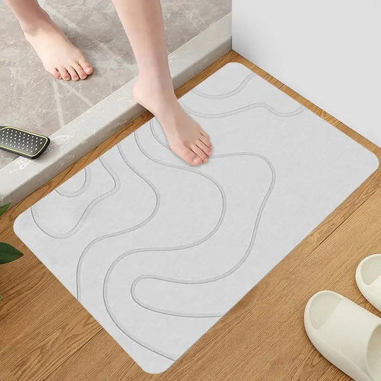 Absorbent stone bath mat with diatom mud material