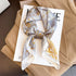 Luxury brand silk plaid square scarf for women, styled as a neck or hair tie