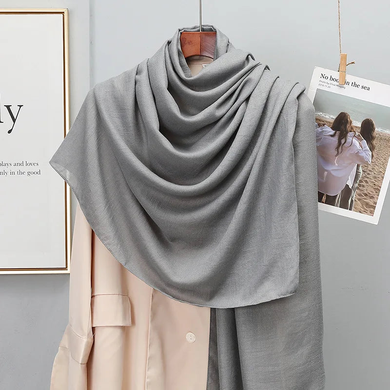 Elegant striped shawl wrap with tassel ends, suitable for casual and formal wear