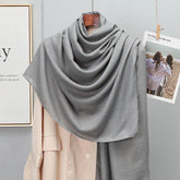 Elegant striped shawl wrap with tassel ends, suitable for casual and formal wear