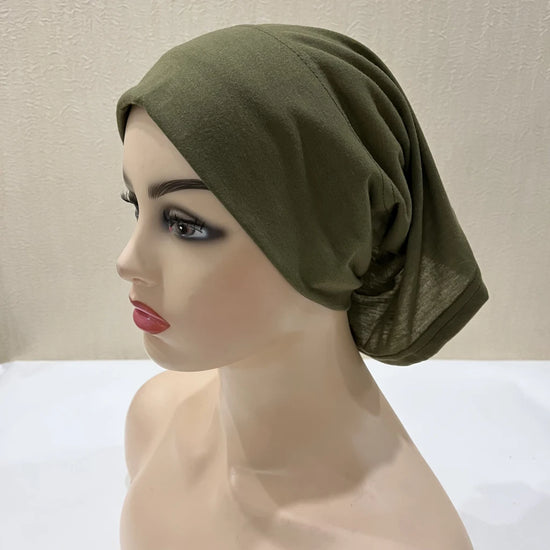 Lightweight spandex turban bonnet in beige, styled under a chiffon hijab