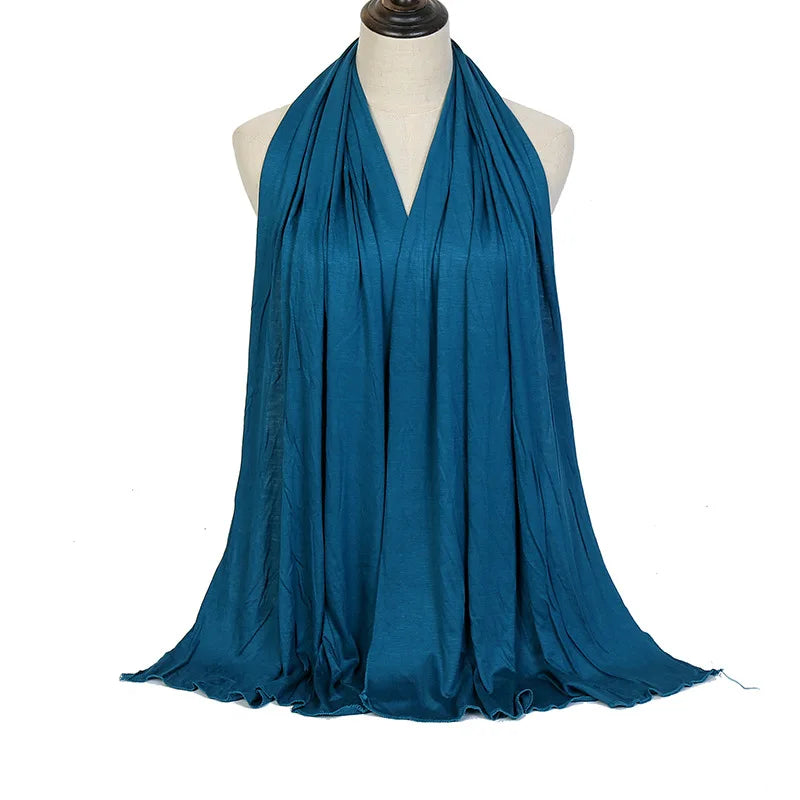 Long Muslim shawl made of modal cotton jersey fabric, wrapped elegantly around the head and ne