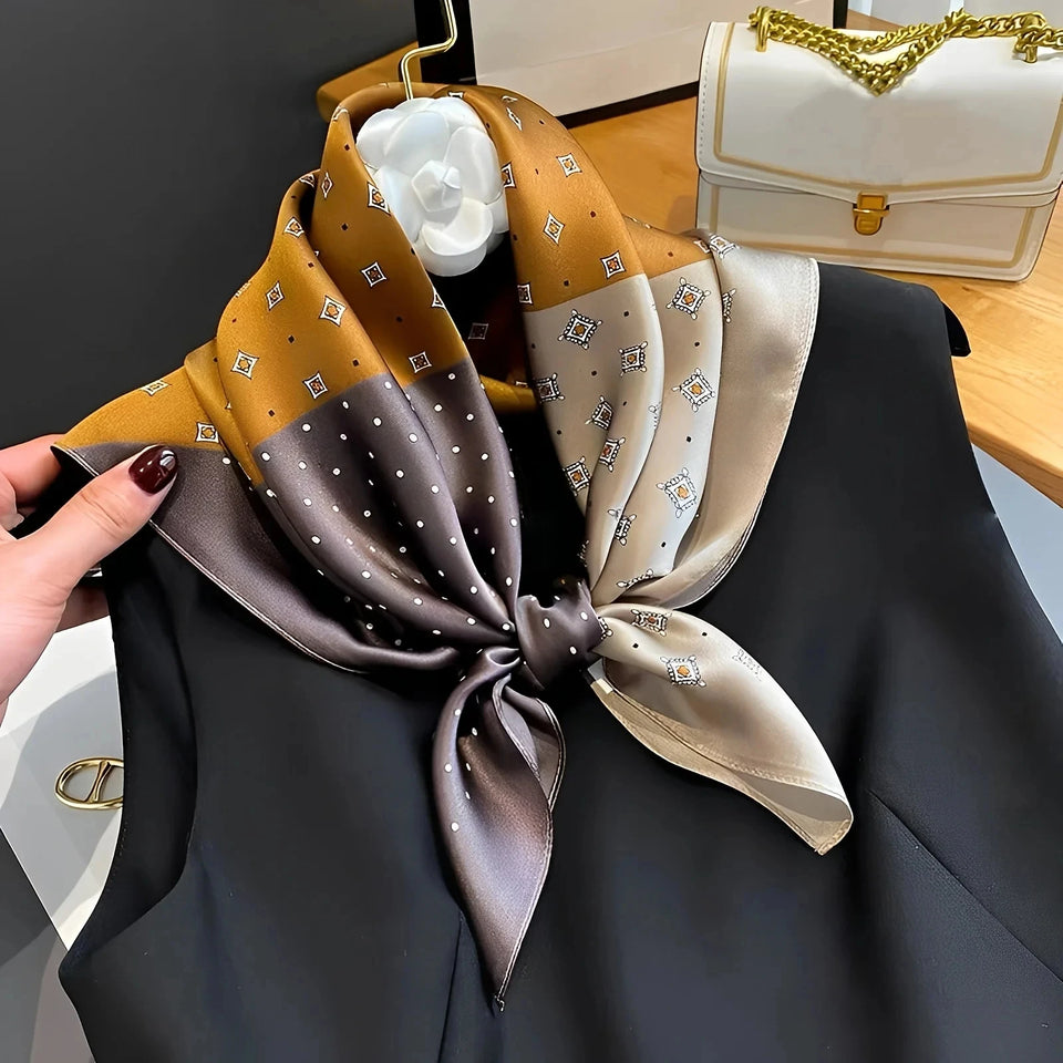 Elegant silk-feel scarf featuring intricate patterns, used as a headband or hair accessory