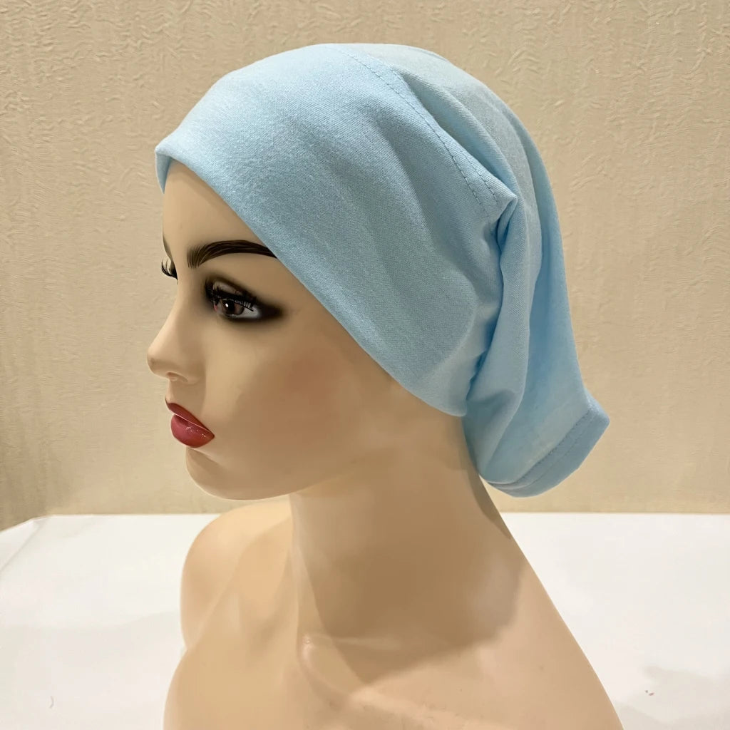 Lightweight spandex turban bonnet in beige, styled under a chiffon hijab