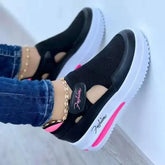 Women’s walking shoes with elevated platform sole and breathable mesh material