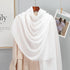 Elegant striped shawl wrap with tassel ends, suitable for casual and formal wear