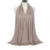 Soft plain cotton headscarf for women, used as a hijab or stylish headband wrap
