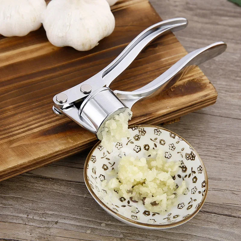 Stainless steel manual garlic press for crushing garlic into paste