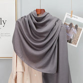 Elegant striped shawl wrap with tassel ends, suitable for casual and formal wear