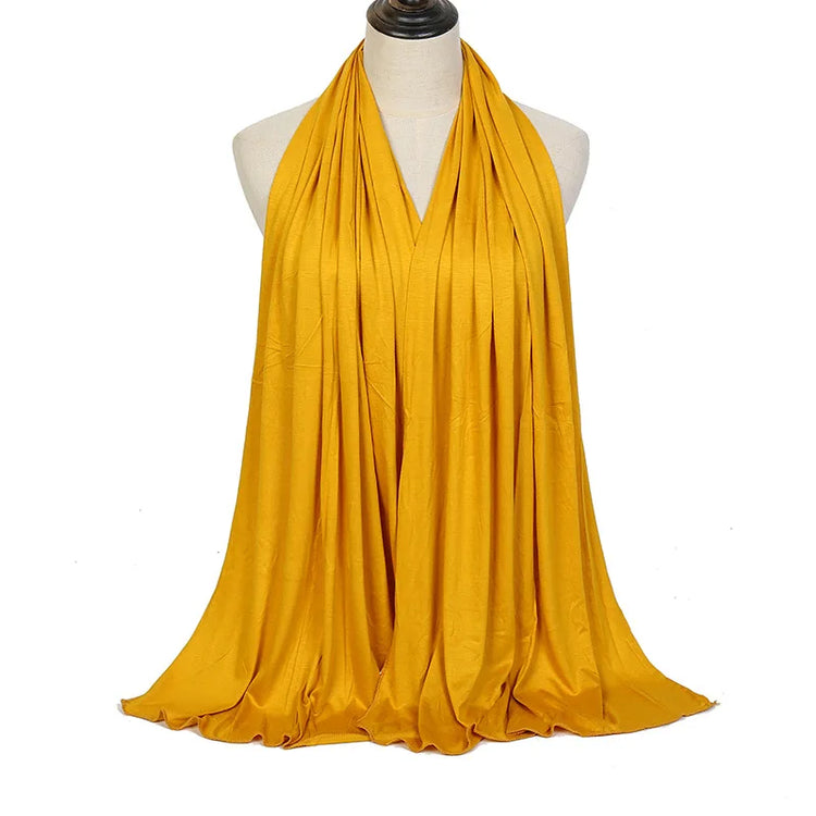 Long Muslim shawl made of modal cotton jersey fabric, wrapped elegantly around the head and ne