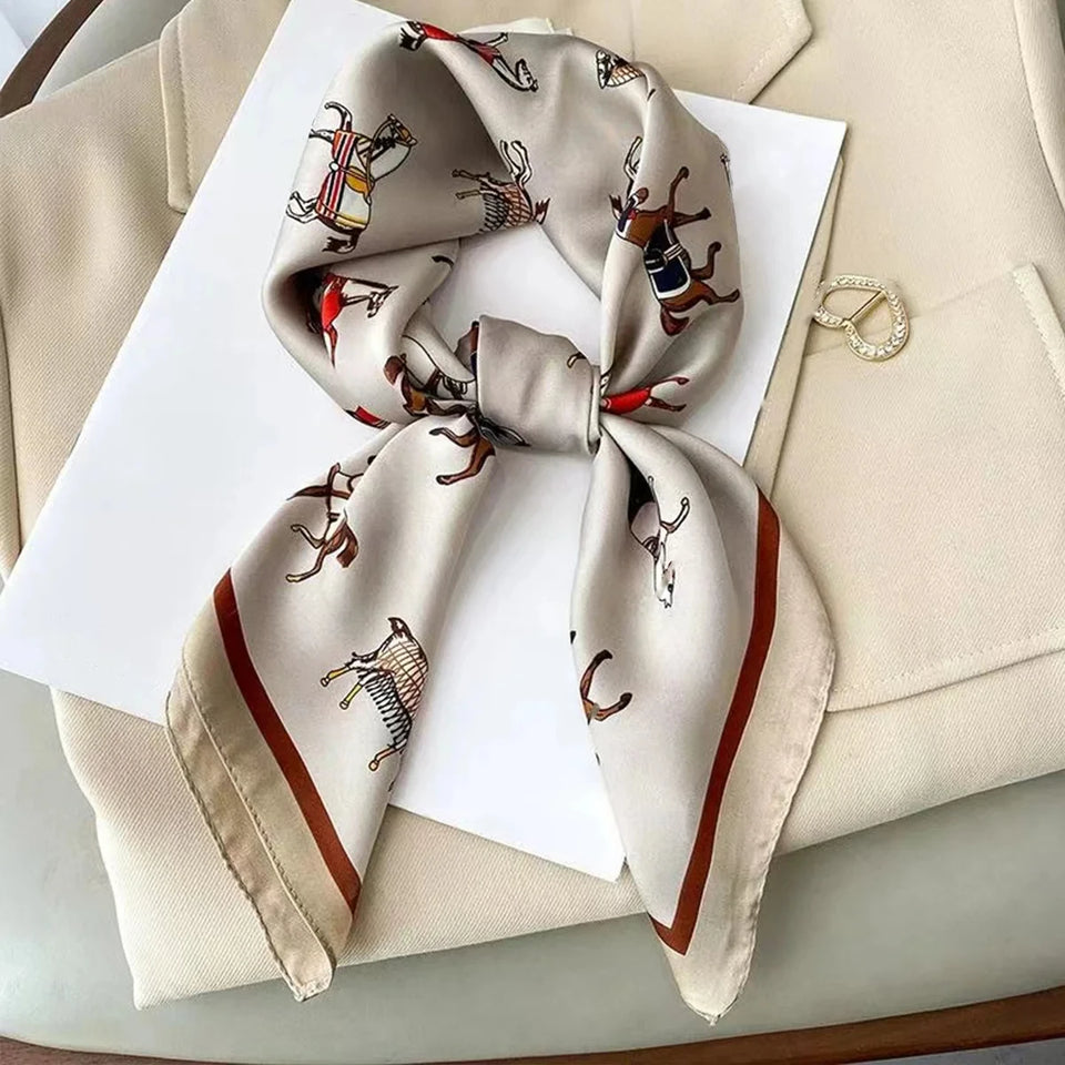 Elegant silk-feel scarf featuring intricate patterns, used as a headband or hair accessory