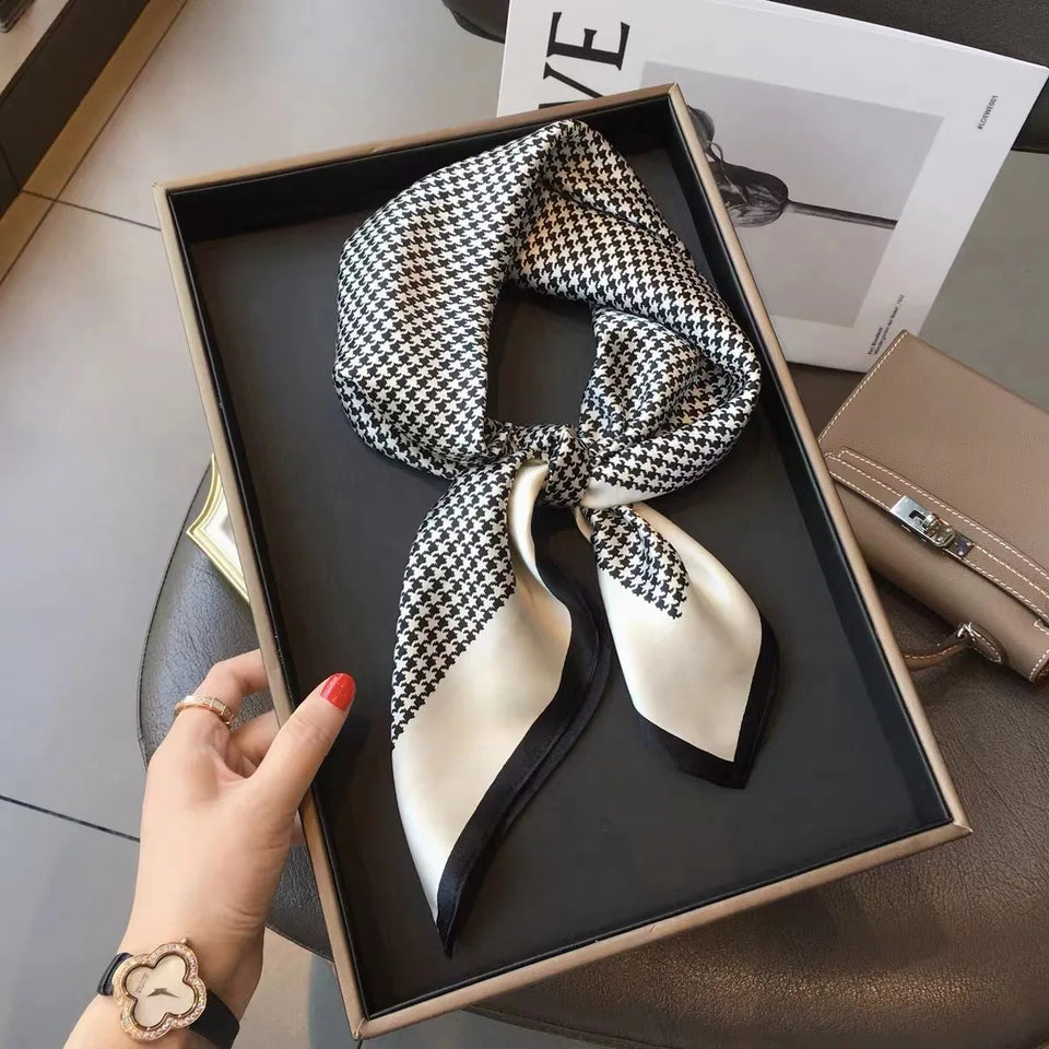 Elegant silk-feel scarf featuring intricate patterns, used as a headband or hair accessory