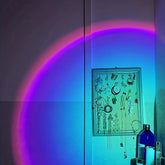 Sunset projection lamp illuminating room with colorful light