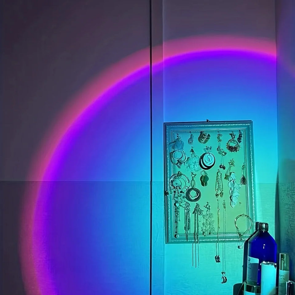 Sunset projection lamp illuminating room with colorful light