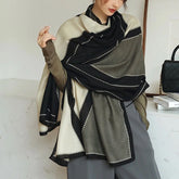 Elegant striped shawl wrap with tassel ends, suitable for casual and formal wear