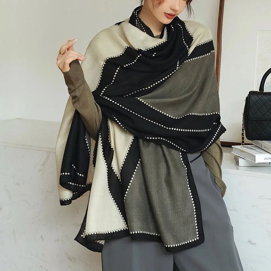 Elegant striped shawl wrap with tassel ends, suitable for casual and formal wear