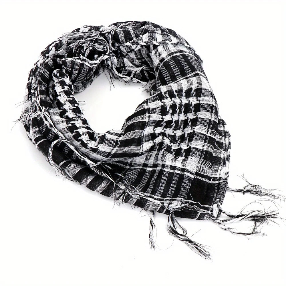 Arab shemagh scarf with traditional houndstooth pattern, styled as a face and neck wrap for sun protection