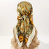 Elegant paisley print scarf styled as a fashionable necktie or handbag accessory